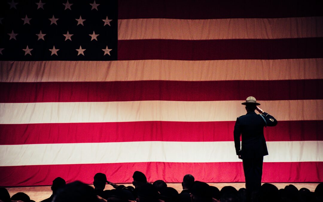 Soldier saluting american flag